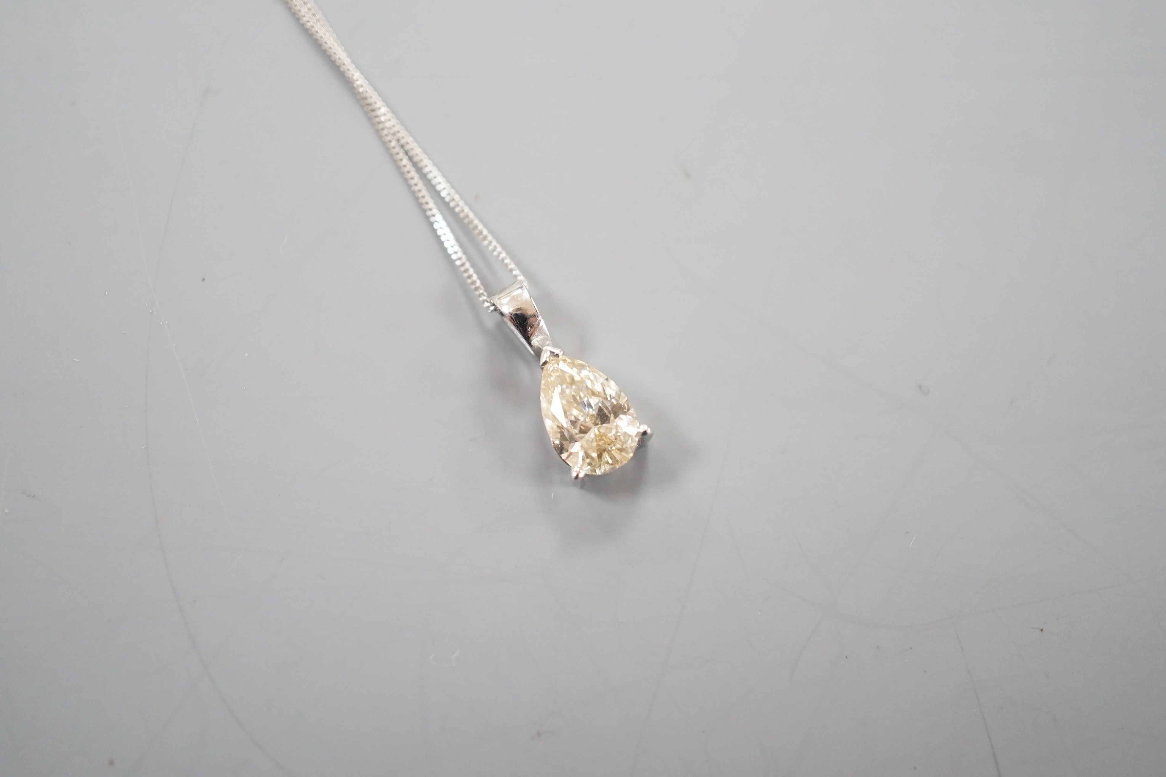 A modern white metal and light brown pear cut diamond set pendant, 14mm, on an 18ct white gold fine link chain, 45cm